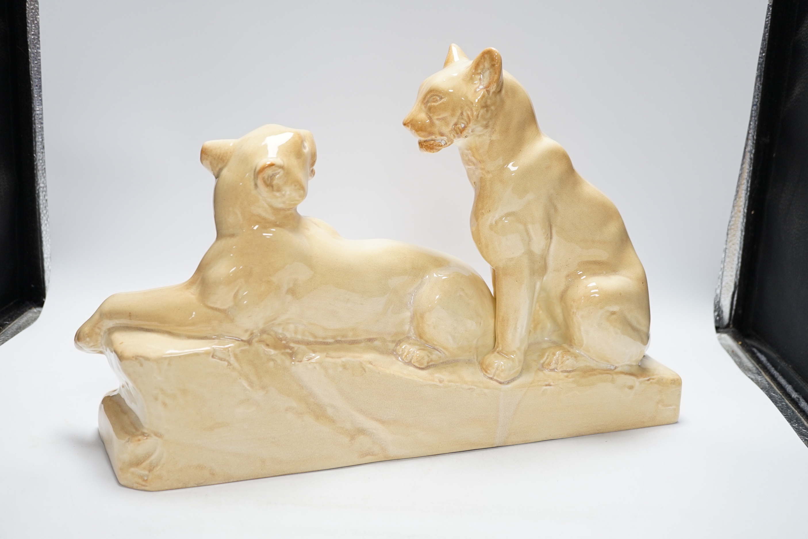 An Art Deco porcelain panther group, signed odyv, 45cm